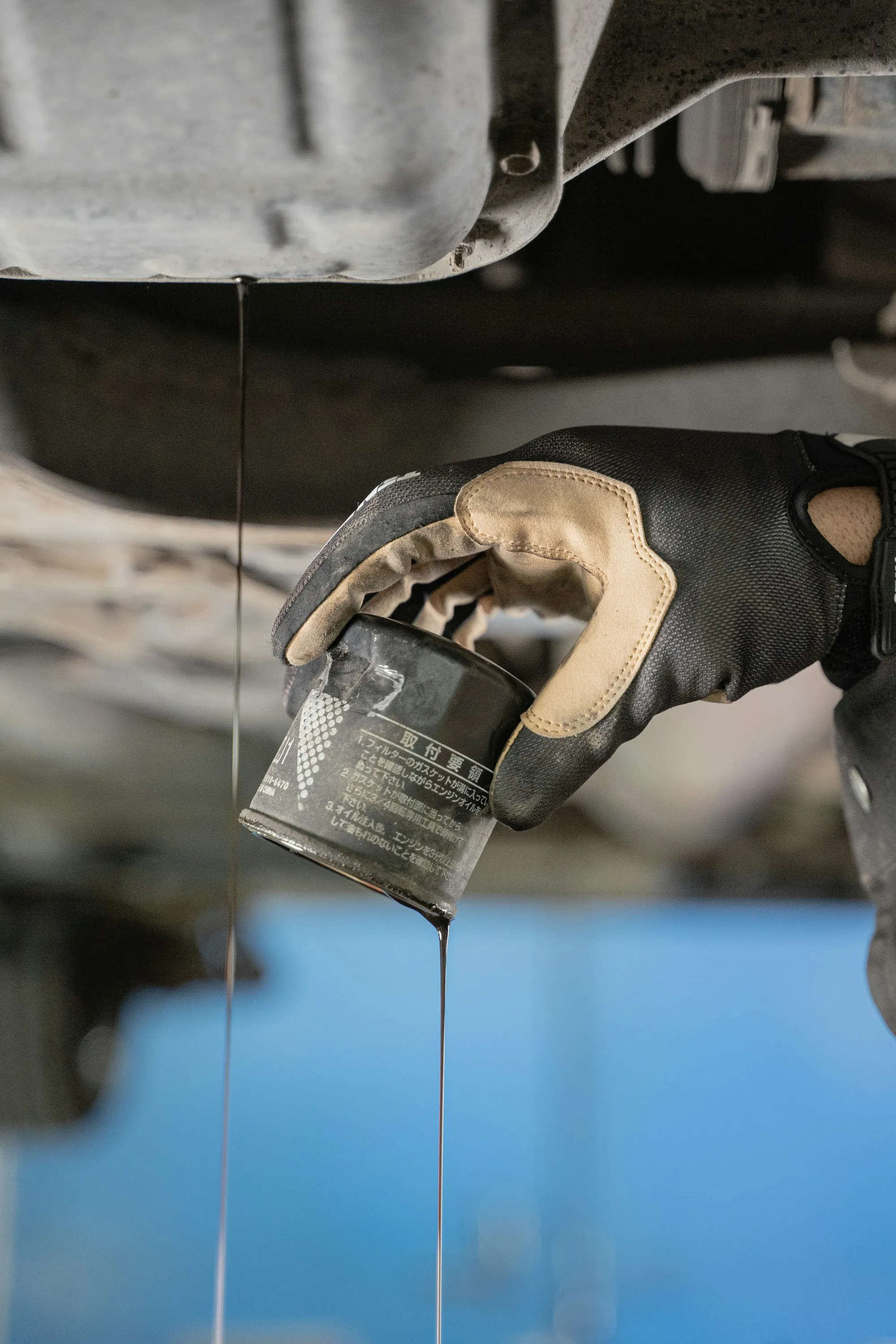 Close view of oil dripping from an engine component