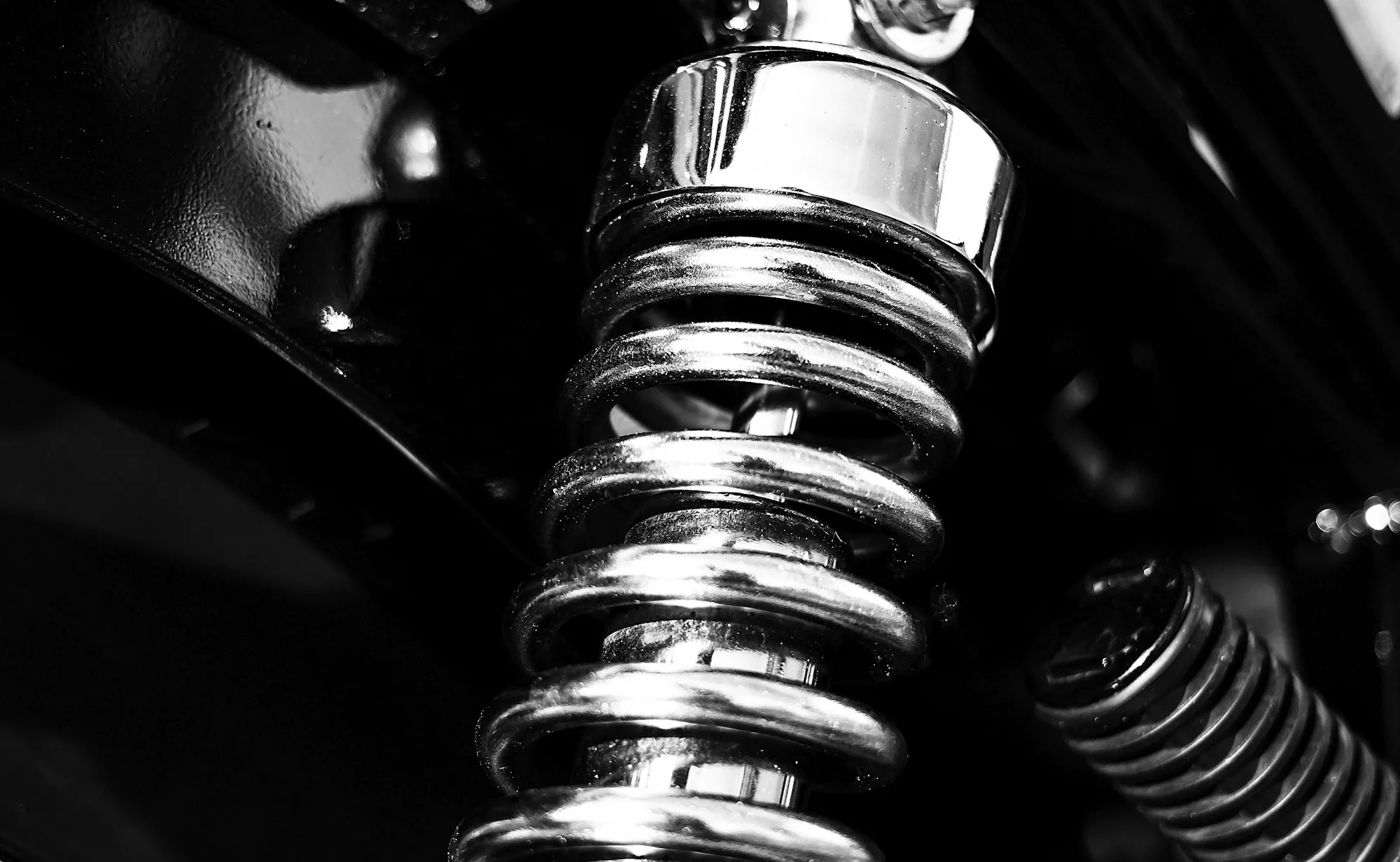 Coil spring and shock absorber close up on a vehicle