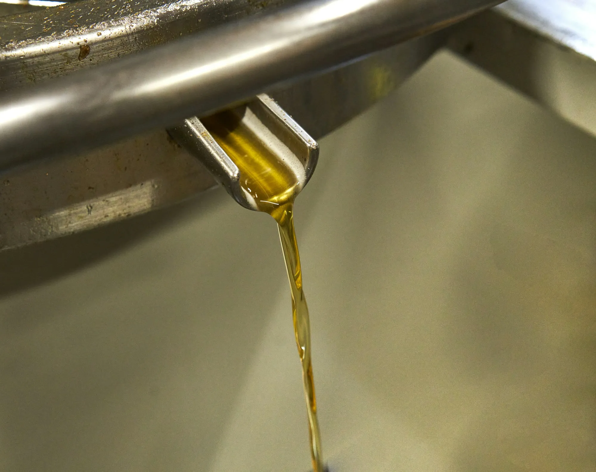Oil pouring from a container into an engine